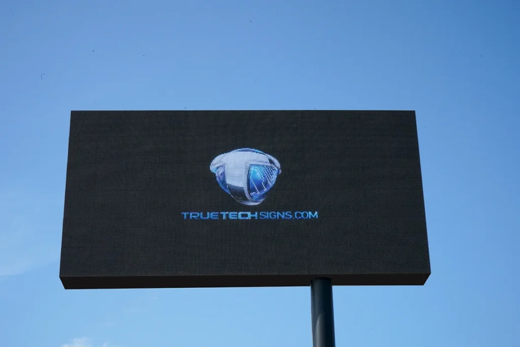 A digital sign that reads True Tech Signs dot com